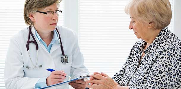 Female doctor talking to patient