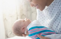 A mother holding her newborn baby